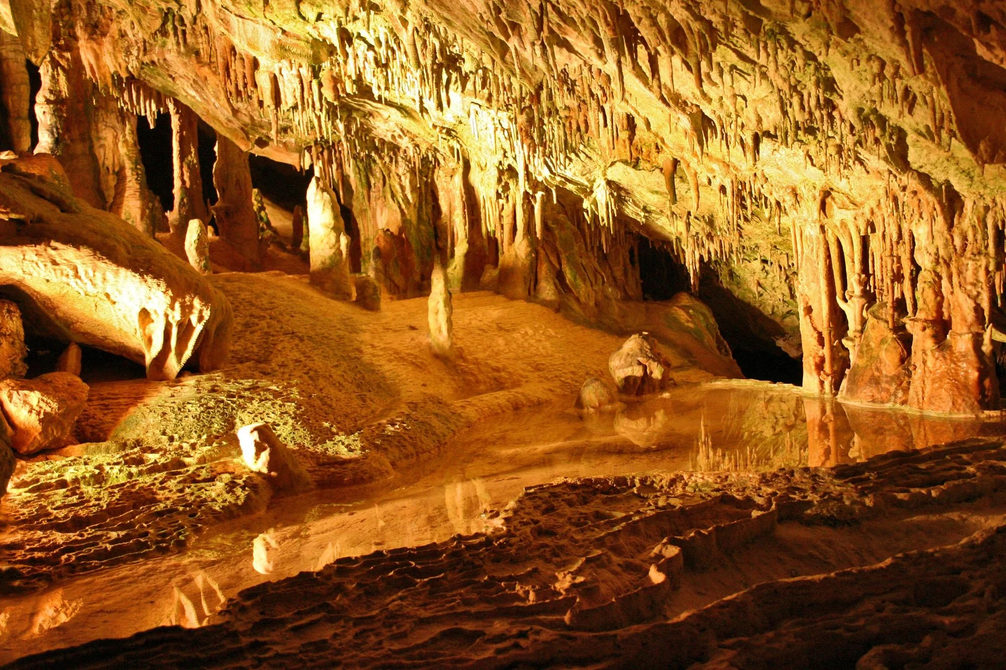 Lit chamber full of stalactites in Can Marçà cave, Ibiza